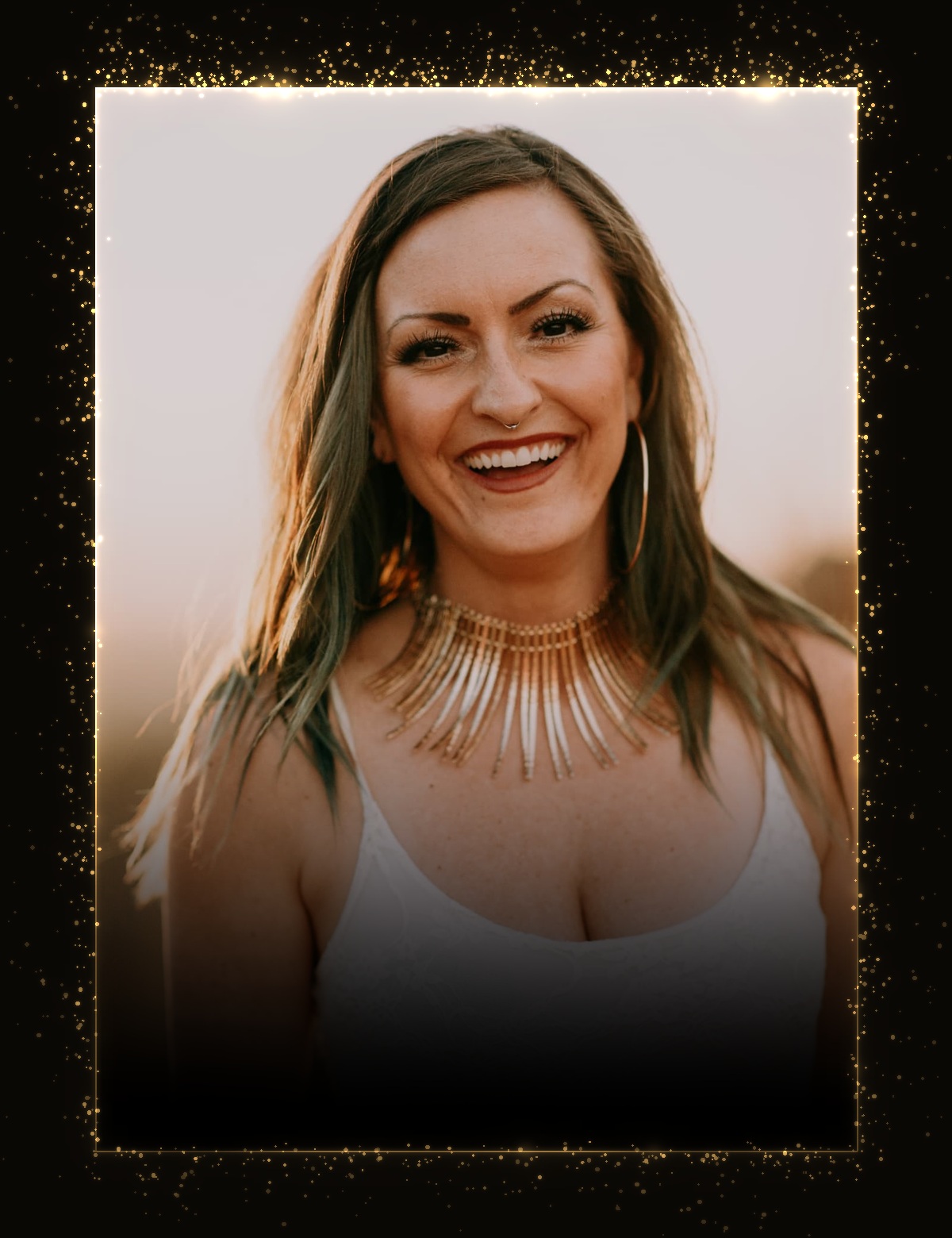 Jenna smiling in golden-hour light